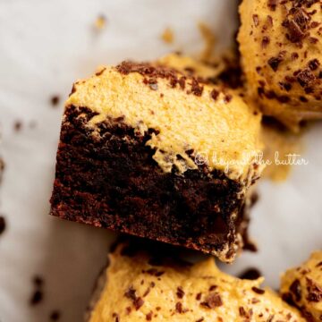 Closeup of pumpkin frosted brownie on its side | © Beyond the Butter®