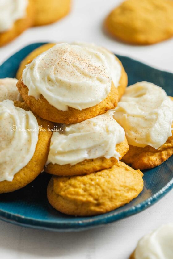 Plate of pumpkin cinnamon cookies with vanilla cream cheese frosting | All Images © Beyond the Butter™
