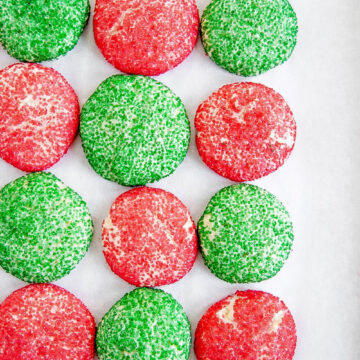 Almond Sprinkle Cookies | overhead shot of red and green almond sprinkle cookies in an alternating patter | Image Credit: Beyond the Butter, LLC