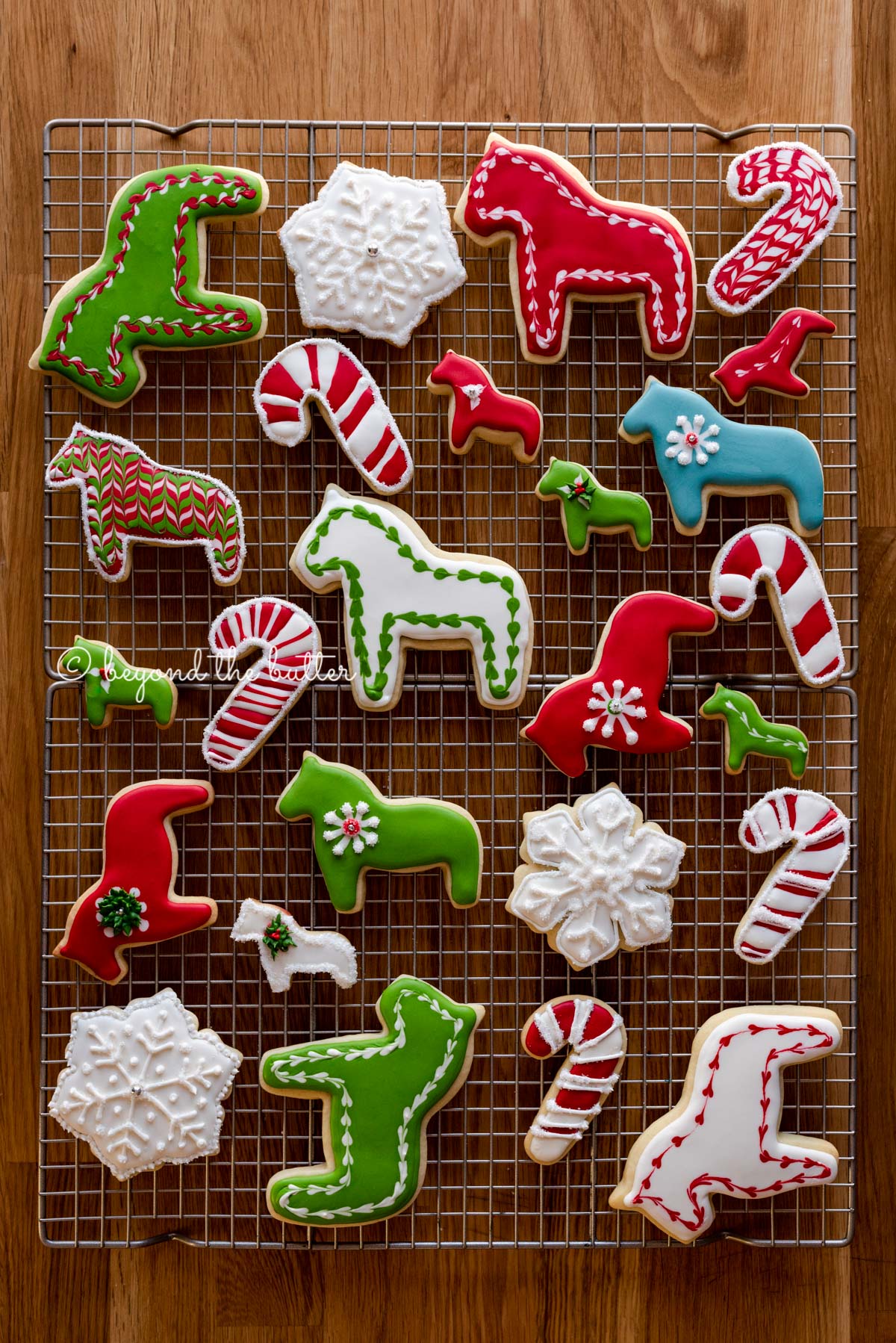 Super soft cut out sugar cookies on a wire cooling rack | All Images © Beyond the Butter®