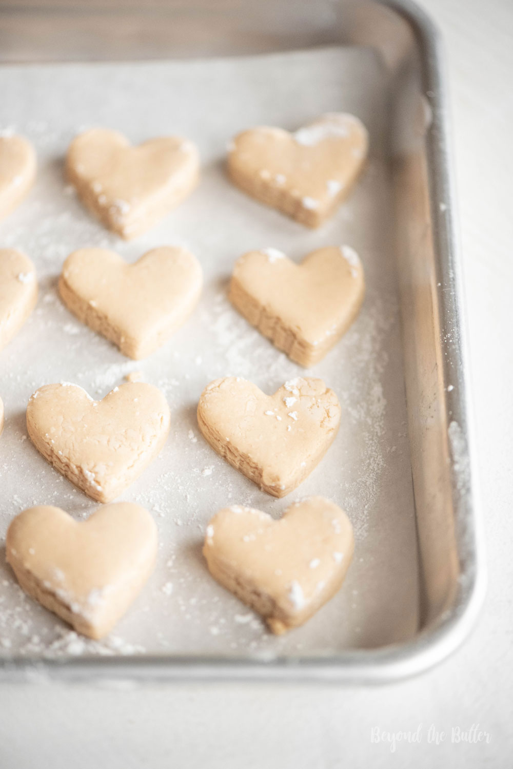 Chocolate Covered Peanut Butter Hearts | Peanut butter hearts cut out and placed on tray ready to be dipped in chocolate | Image and Copyright Policy: Beyond the Butter, LLC