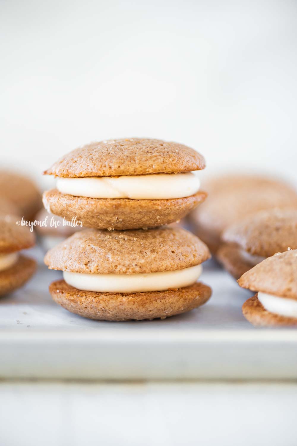 Apple Cider Whoopie Pies with Caramel Cream Cheese Frosting | All Images © Beyond the Butter, LLC