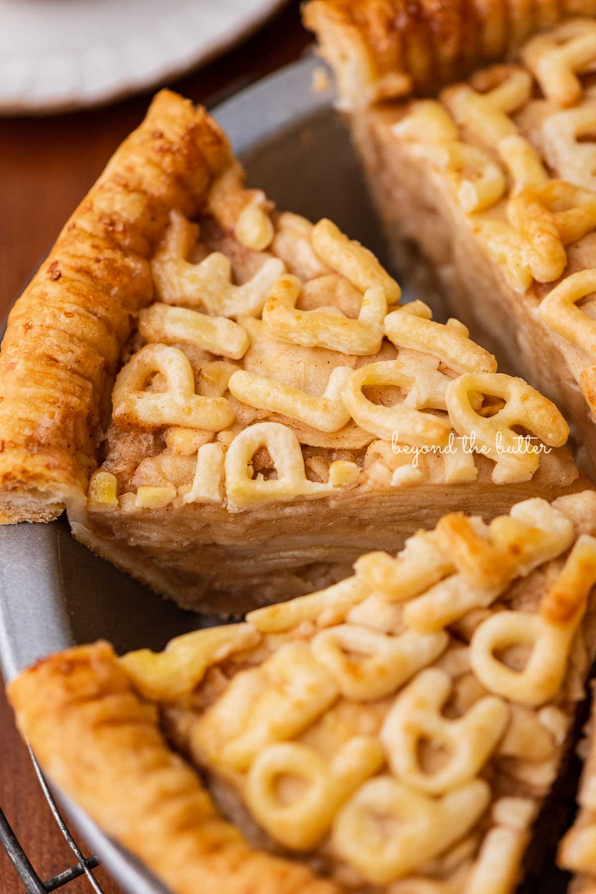 Easy homemade apple pie with slices removed | © Beyond the Butter®