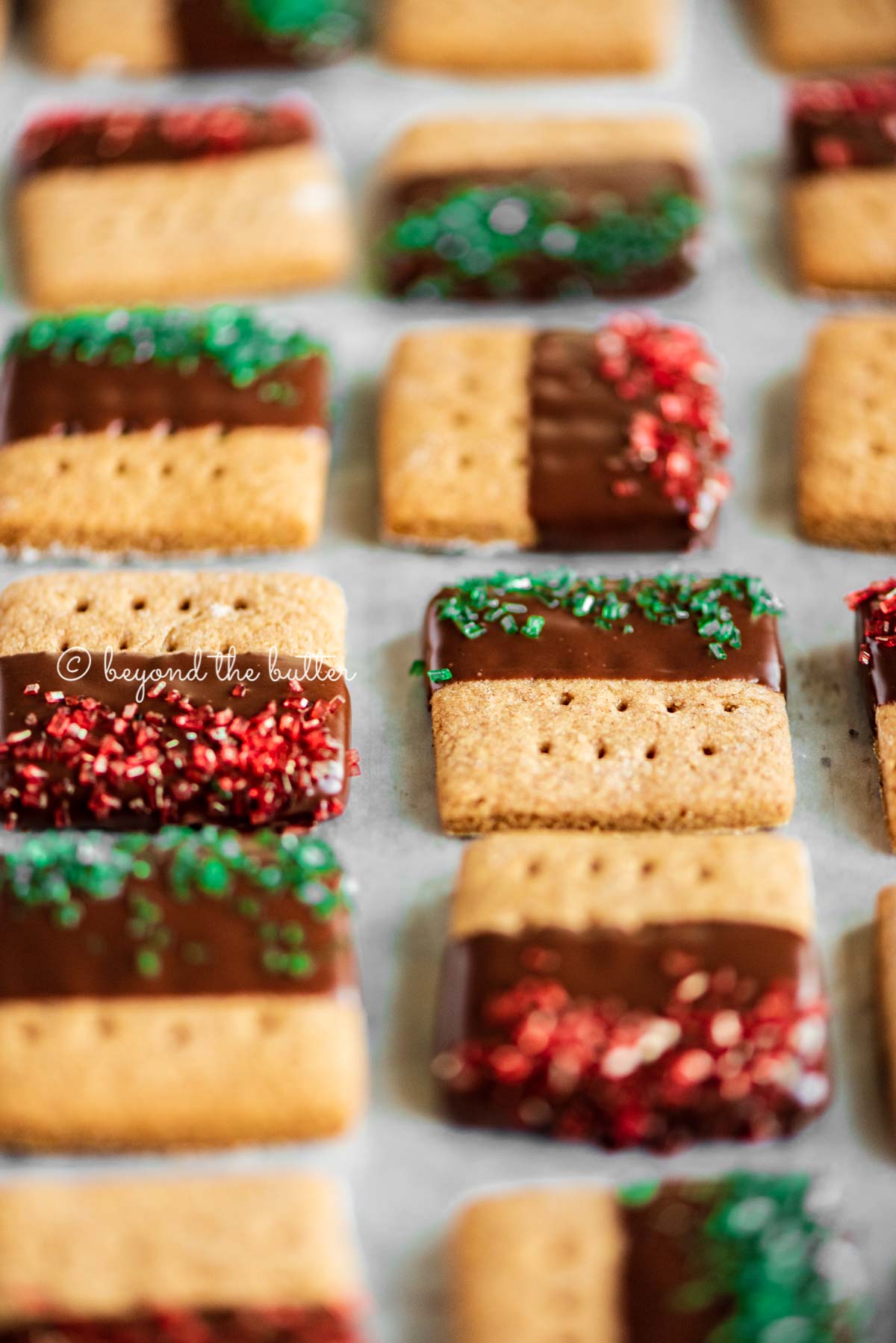 Image of Chocolate Dipped Graham Cracker Sqaures on a cookie sheet | © Beyond the Butter®