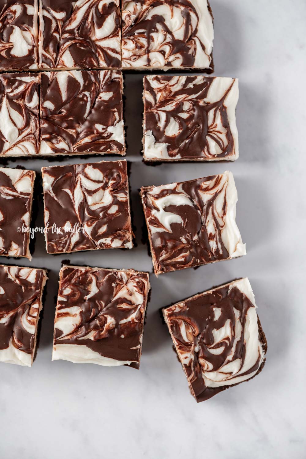 Squares of Chocolate Peppermint Swirled Brownies | All Images © Beyond the Butter, LLC
