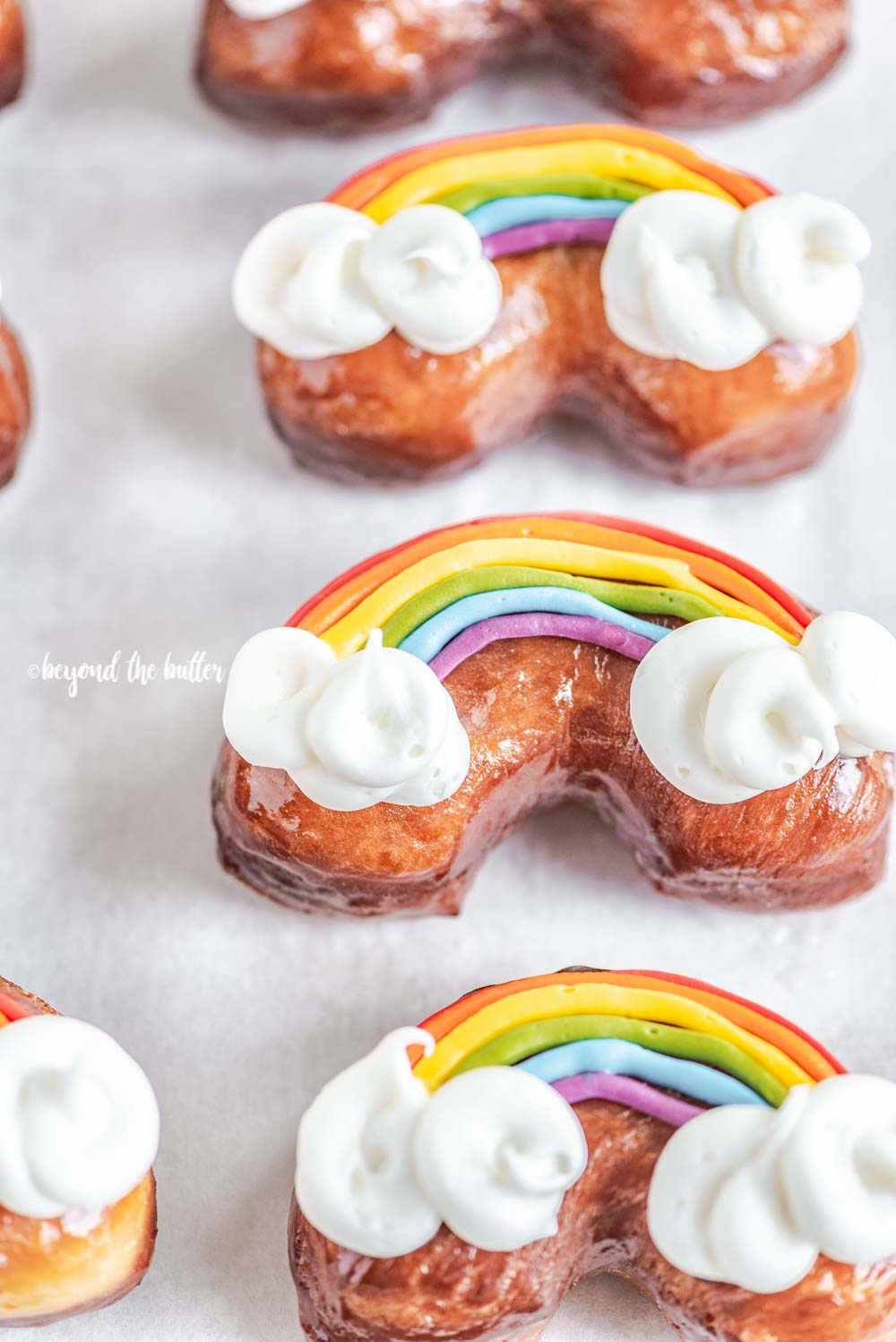 Overhead image of homemade Rainbow Donuts.