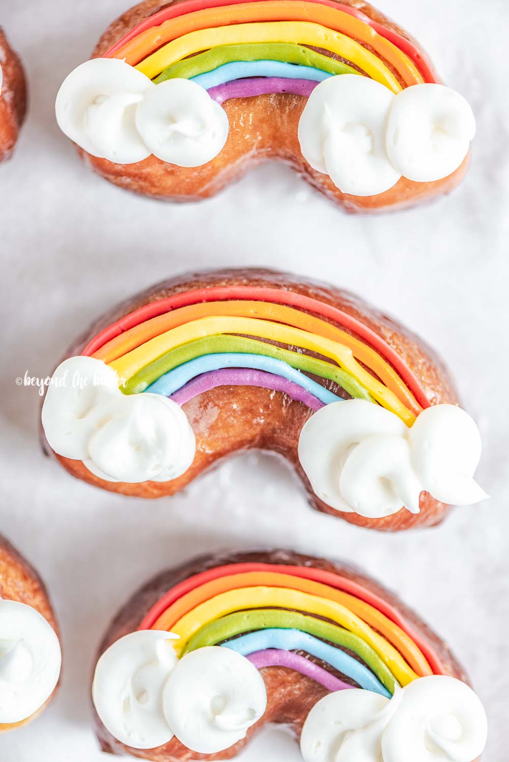 Overhead closeup image of homemade Rainbow Donuts | All Images © Beyond the Butter, LLC