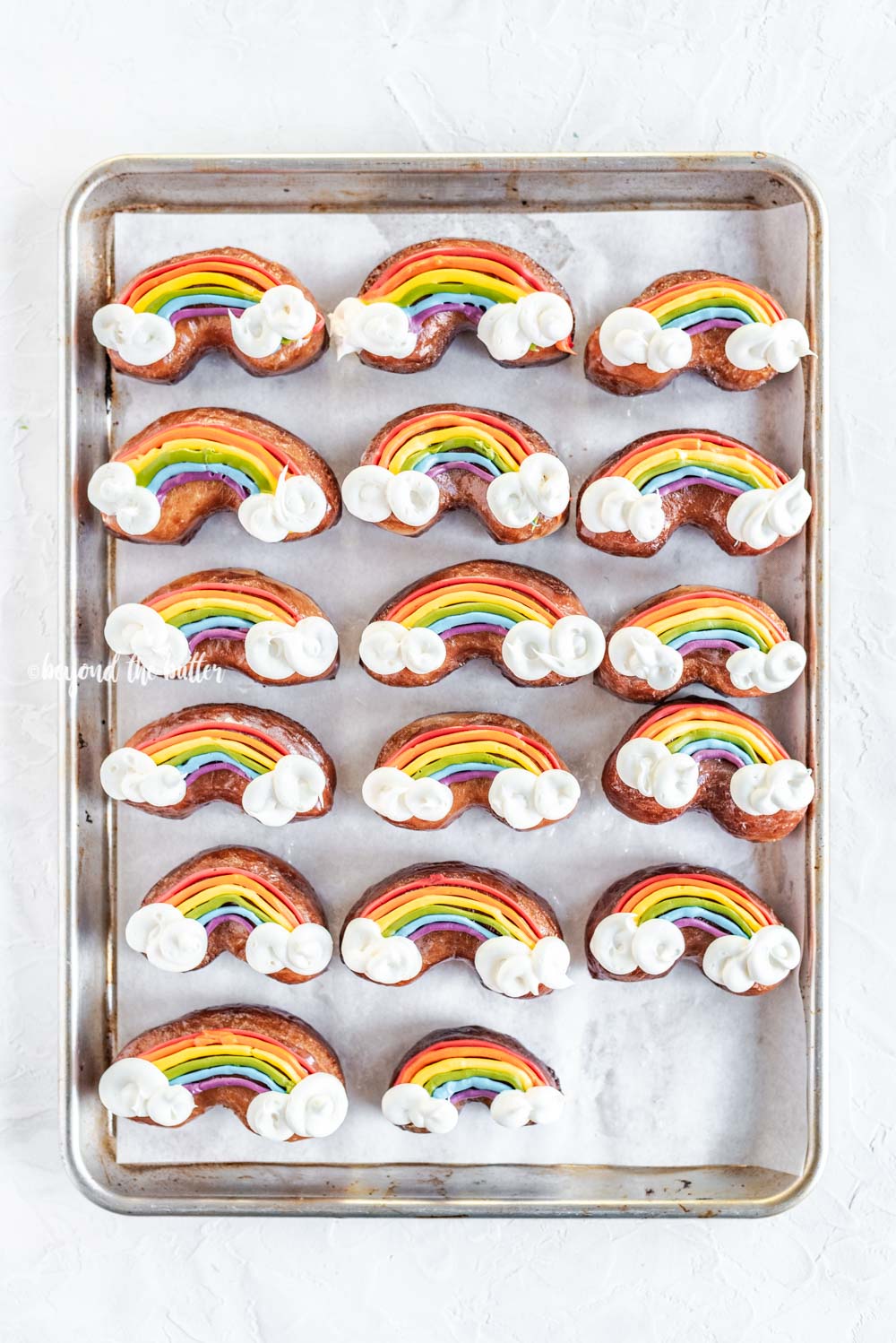 Overhead image of Rainbow Donuts on a baking sheet | All Images © Beyond the Butter, LLC