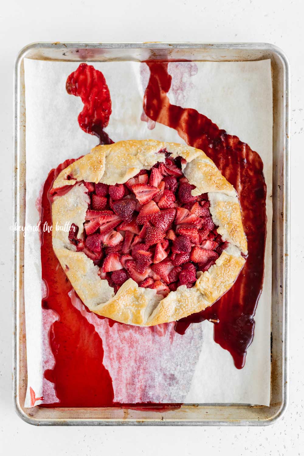 Overhead image of freshly made Berry Nutella Galette on a baking sheet | All Images © Beyond the Butter™
