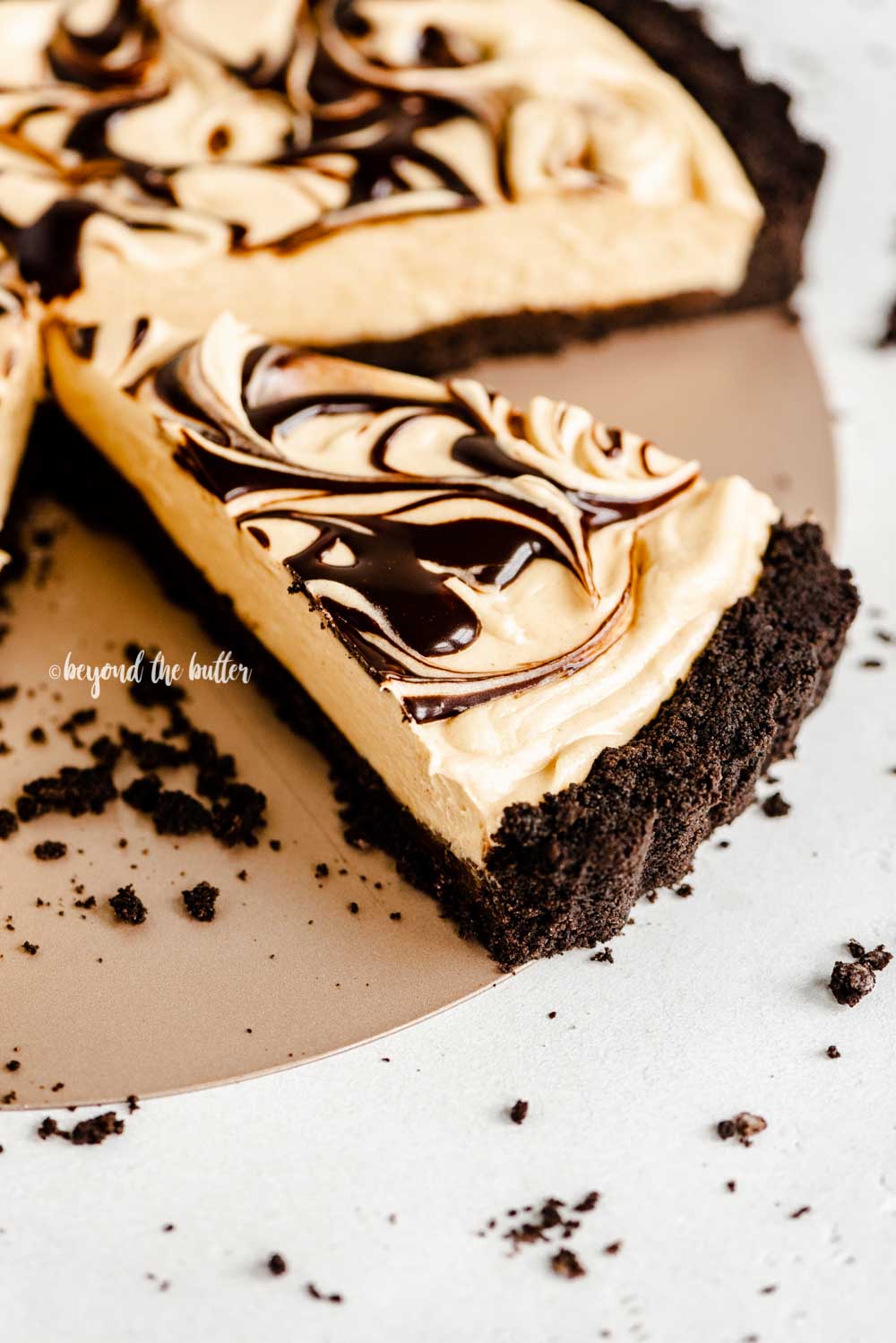 Angled image of a sliced chocolate peanut butter tart | All Images © Beyond the Butter™