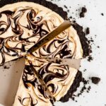 Overhead image of sliced chocolate peanut butter swirl tart.