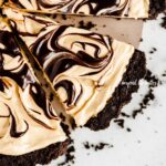 Overhead image of sliced chocolate peanut butter swirl tart.