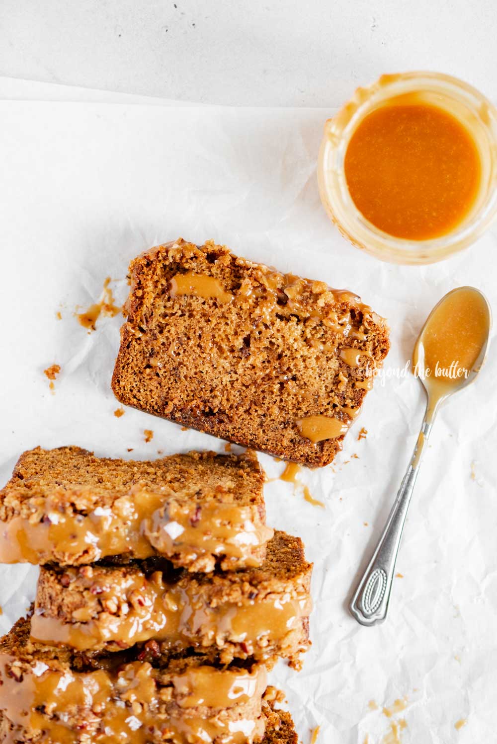 Overhead image of sliced salted caramel banana nut bread | All Images © Beyond the Butter™