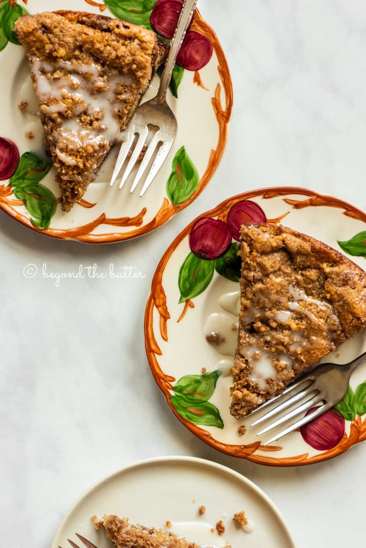 Slices of apple coffee cake on dessert plates | All Images © Beyond the Butter™