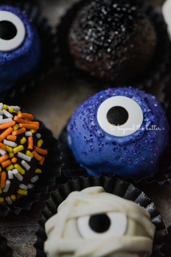 Closeup of Halloween Chocolate Truffles on dark brown background | All Images © Beyond the Butter™