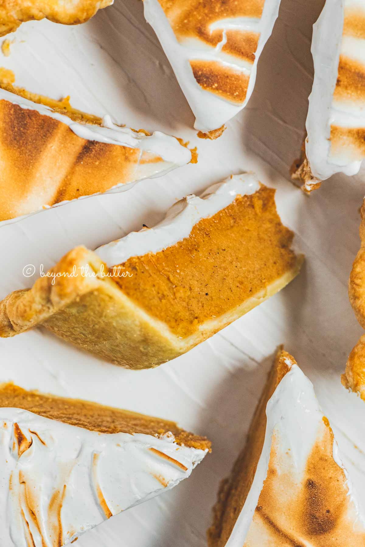 Slices of brown sugar sweet potato pie with center slice on its side | All Images © Beyond the Butter®