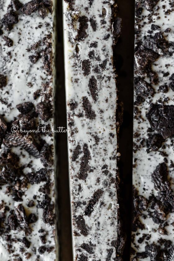 Bars of cookies and cream fudge on brown parchment paper | All Images © Beyond the Butter®