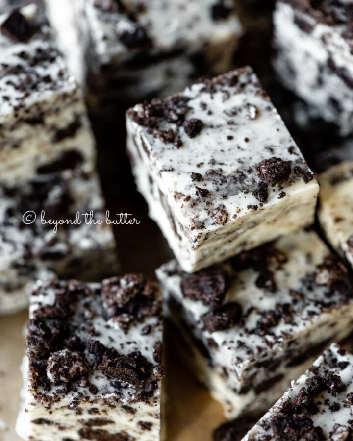 Randomly stacked pieces of cookies and cream fudge.