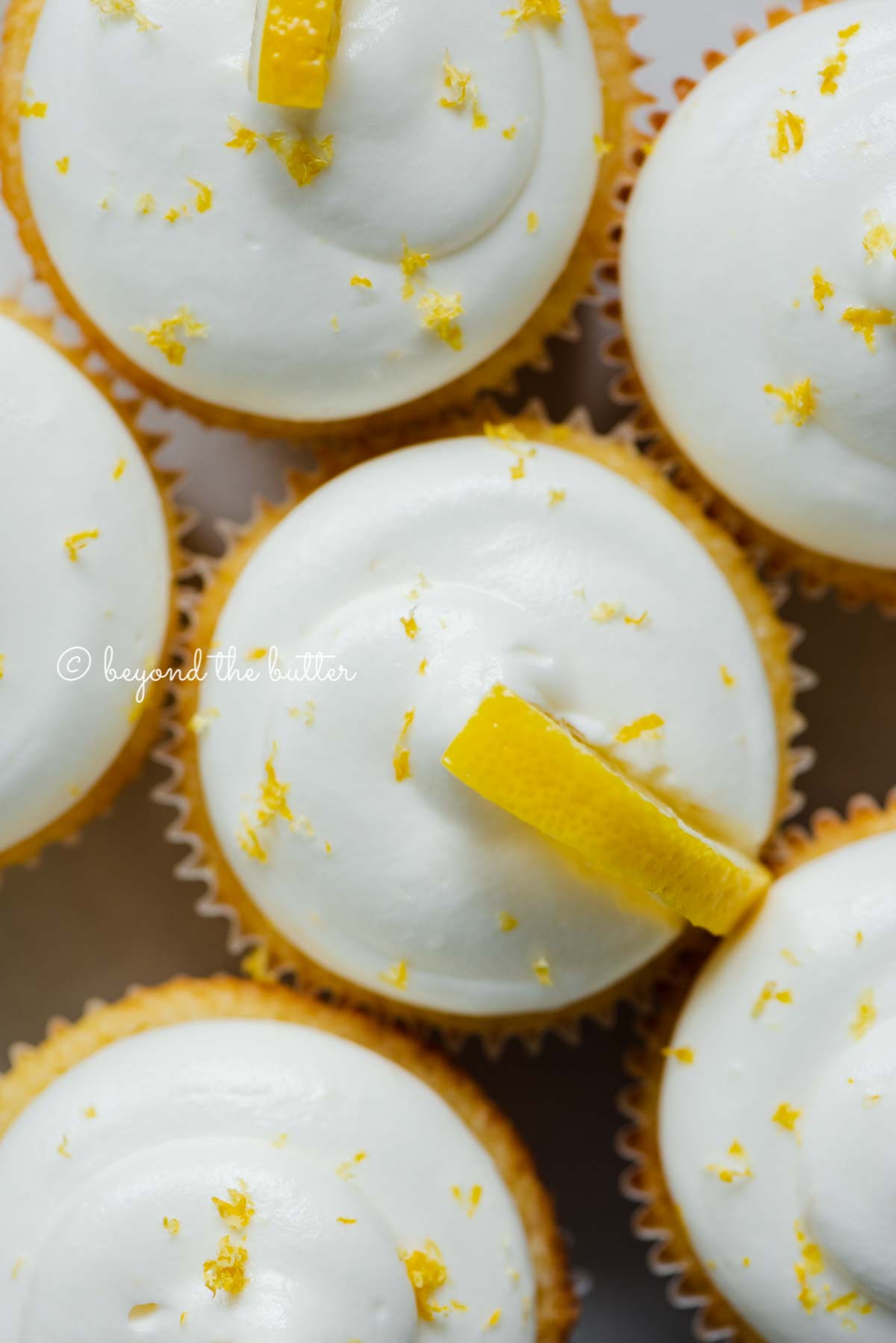 Close up of decorated small batch lemon cupcakes | All Images © Beyond the Butter®