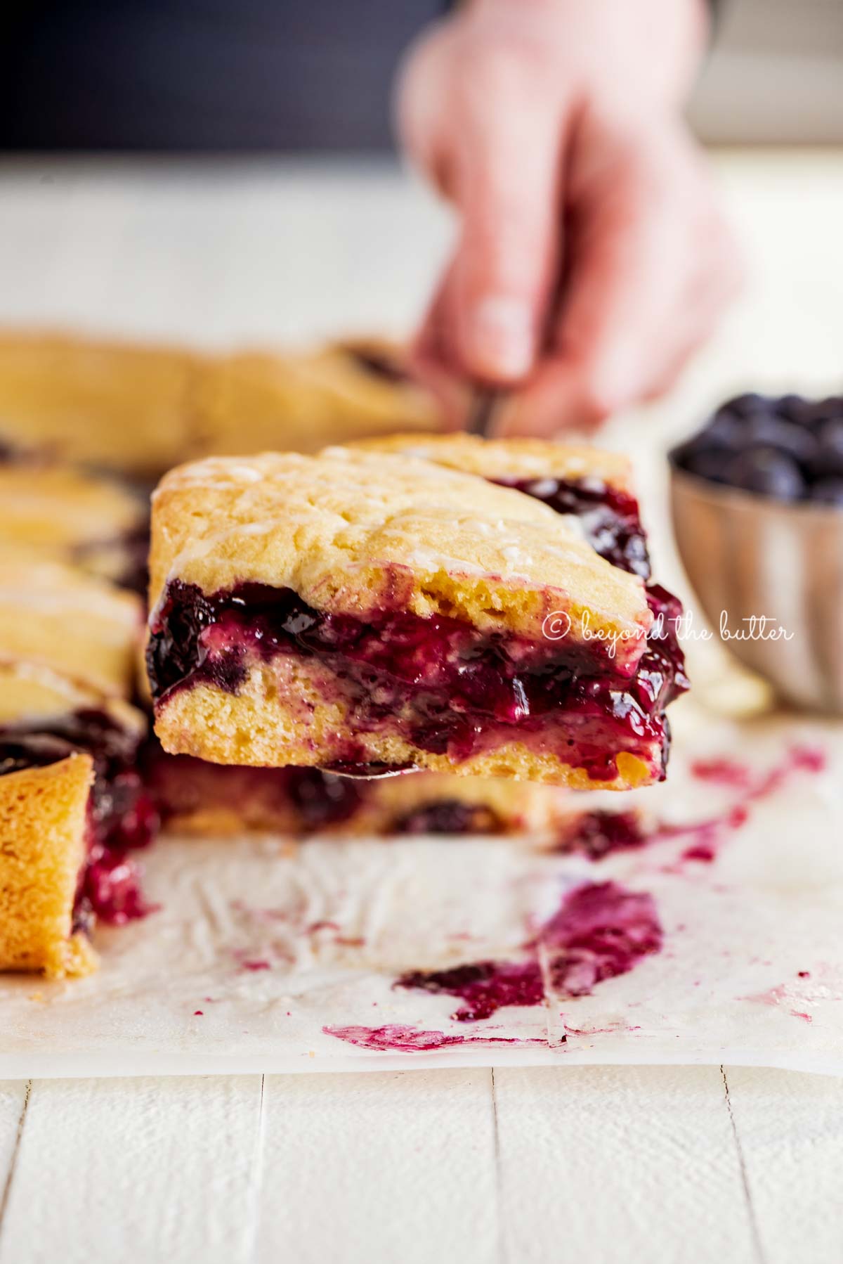 Serving a slice of freshly baked blueberry swirl coffee cake | All Images © Beyond the Butter®