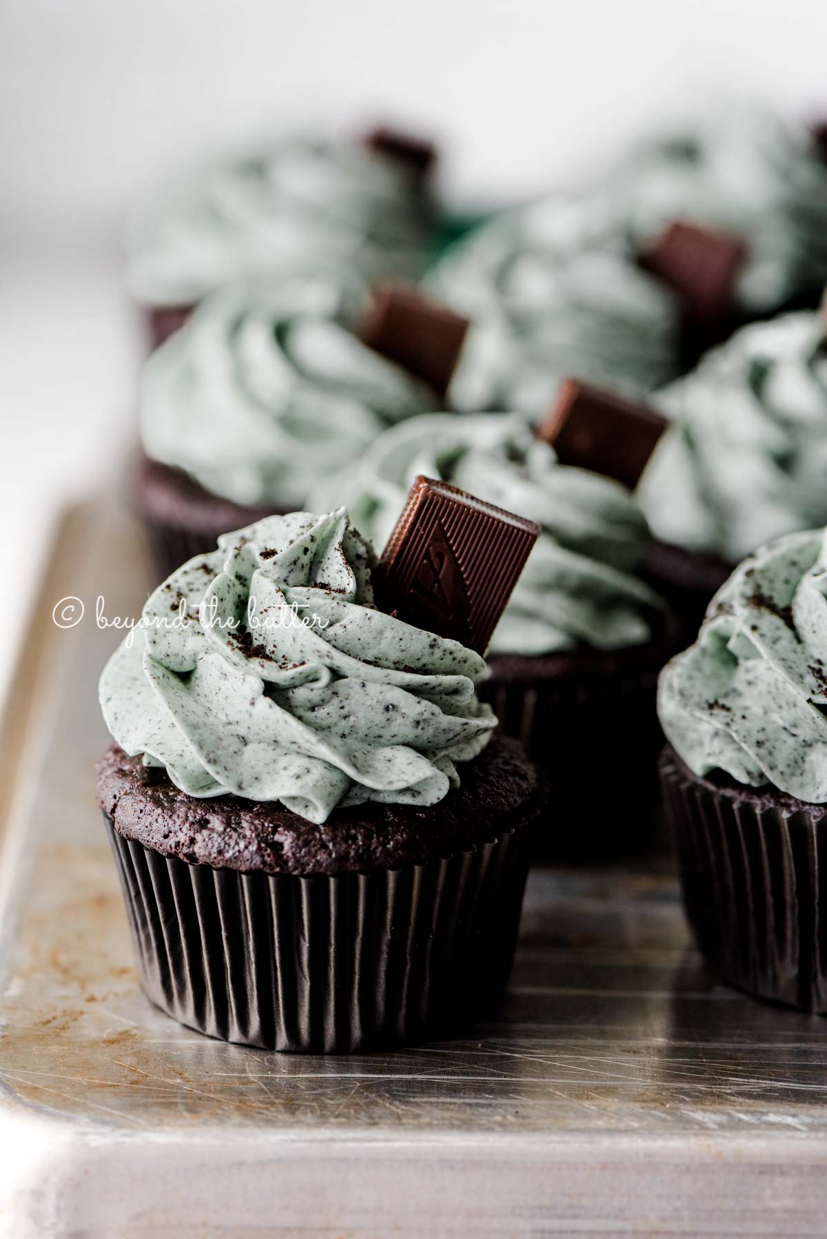 Mint chocolate cupcakes on an upside down baking sheet | All Images © Beyond the Butter®