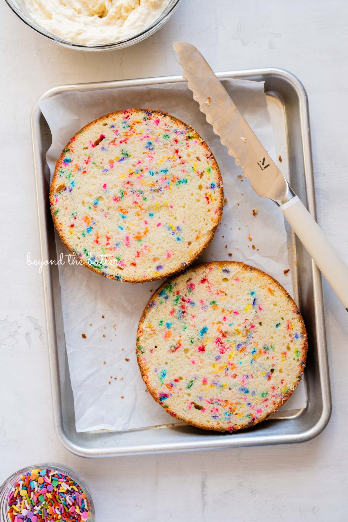 6 inch single layer funfetti cake sliced into two layers with a serrated knife from BeyondtheButter.com | All images © Beyond the Butter®