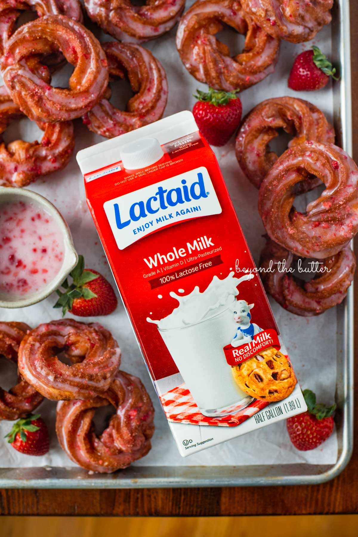 Strawberry glazed french crullers made with LACTAID® 100% real milk without the lactose! Recipe on BeyondtheButter.com | © Beyond the Butter®