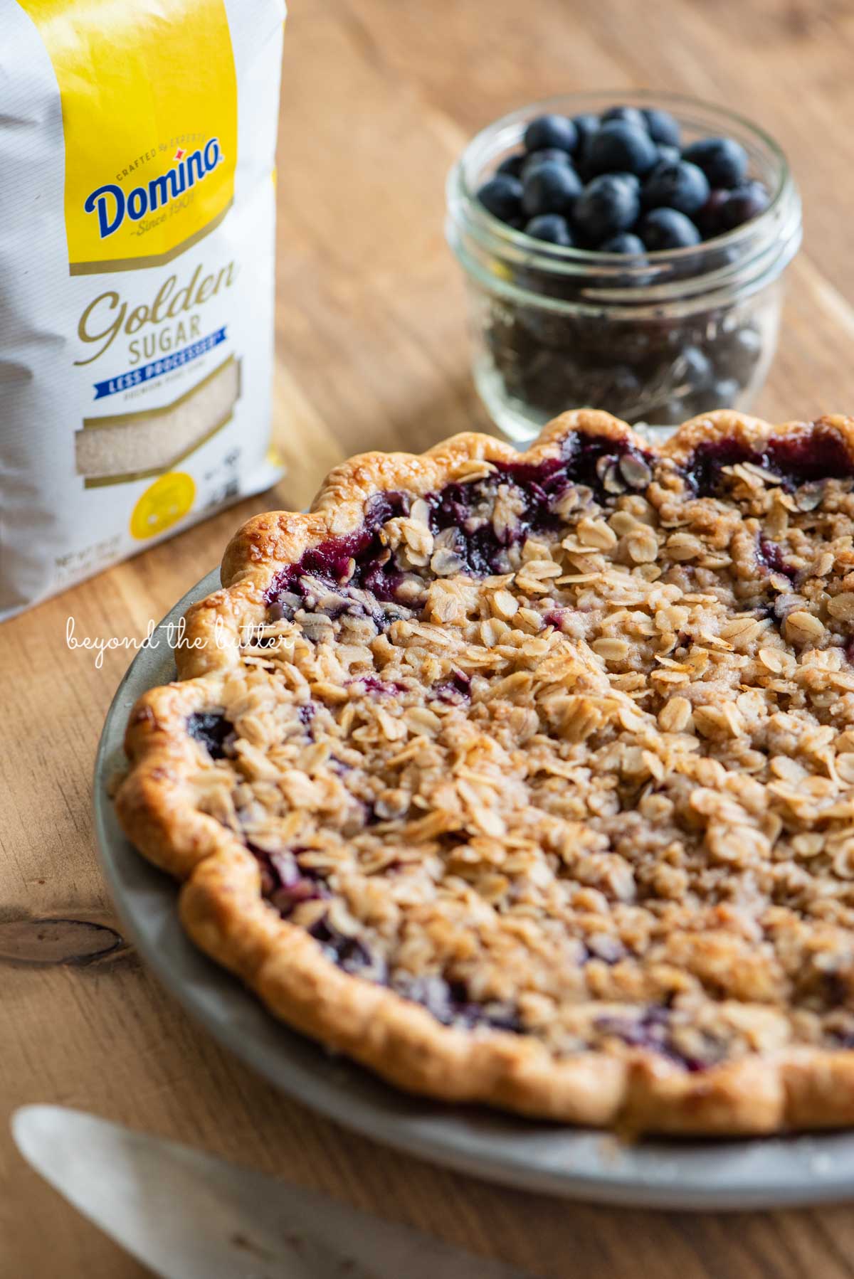 Just baked blueberry crumble pie made with Domino® Golden Sugar | © Beyond the Butter®