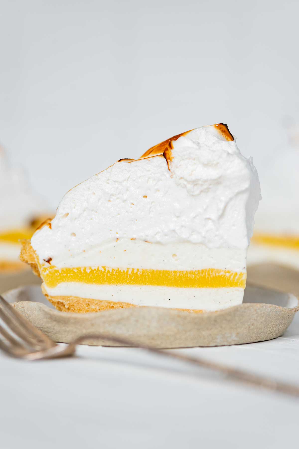 Slices of lemon meringue ice cream pie on dessert plates from BeyondtheButter.com | © Beyond the Butter®