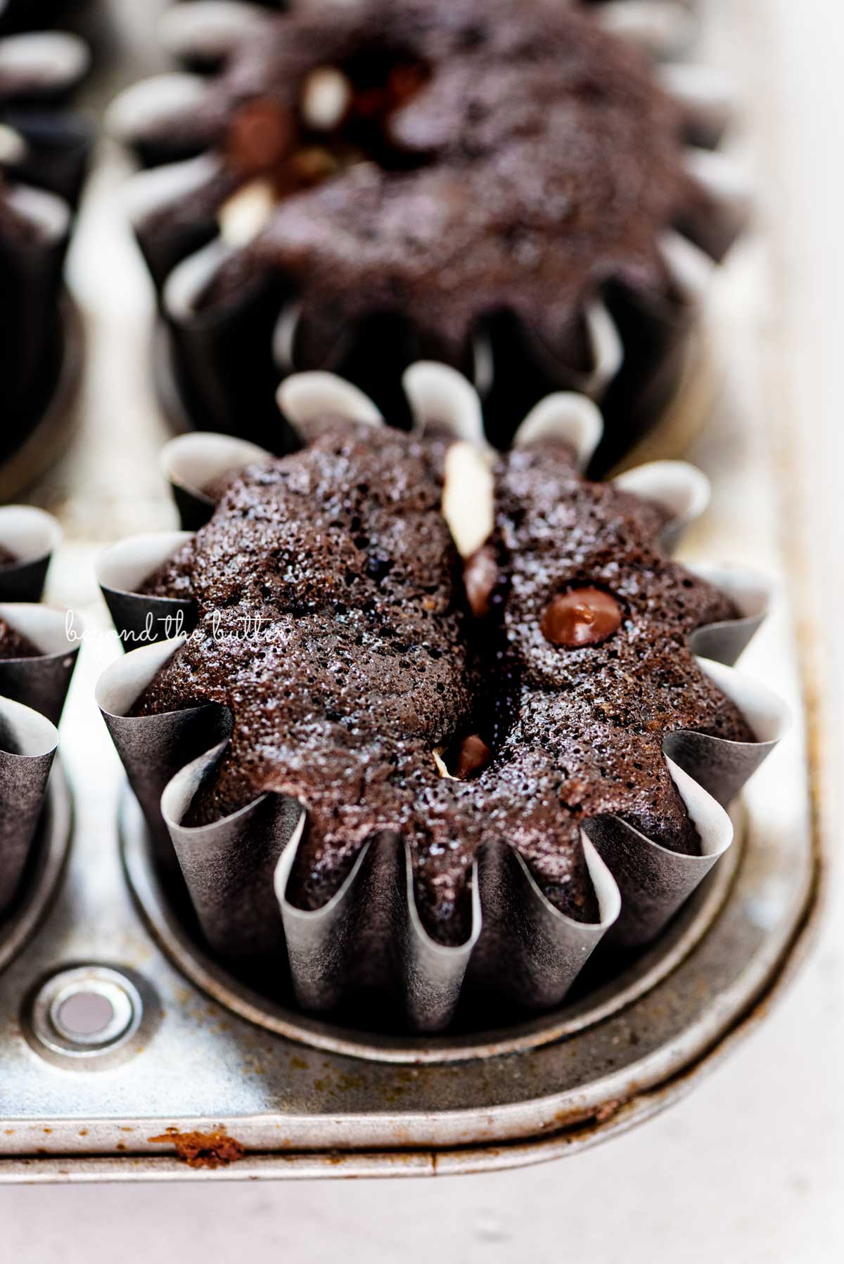 Small batch black bottom cupcakes in a vintage baking tin from BeyondtheButter.com | © Beyond the Butter®