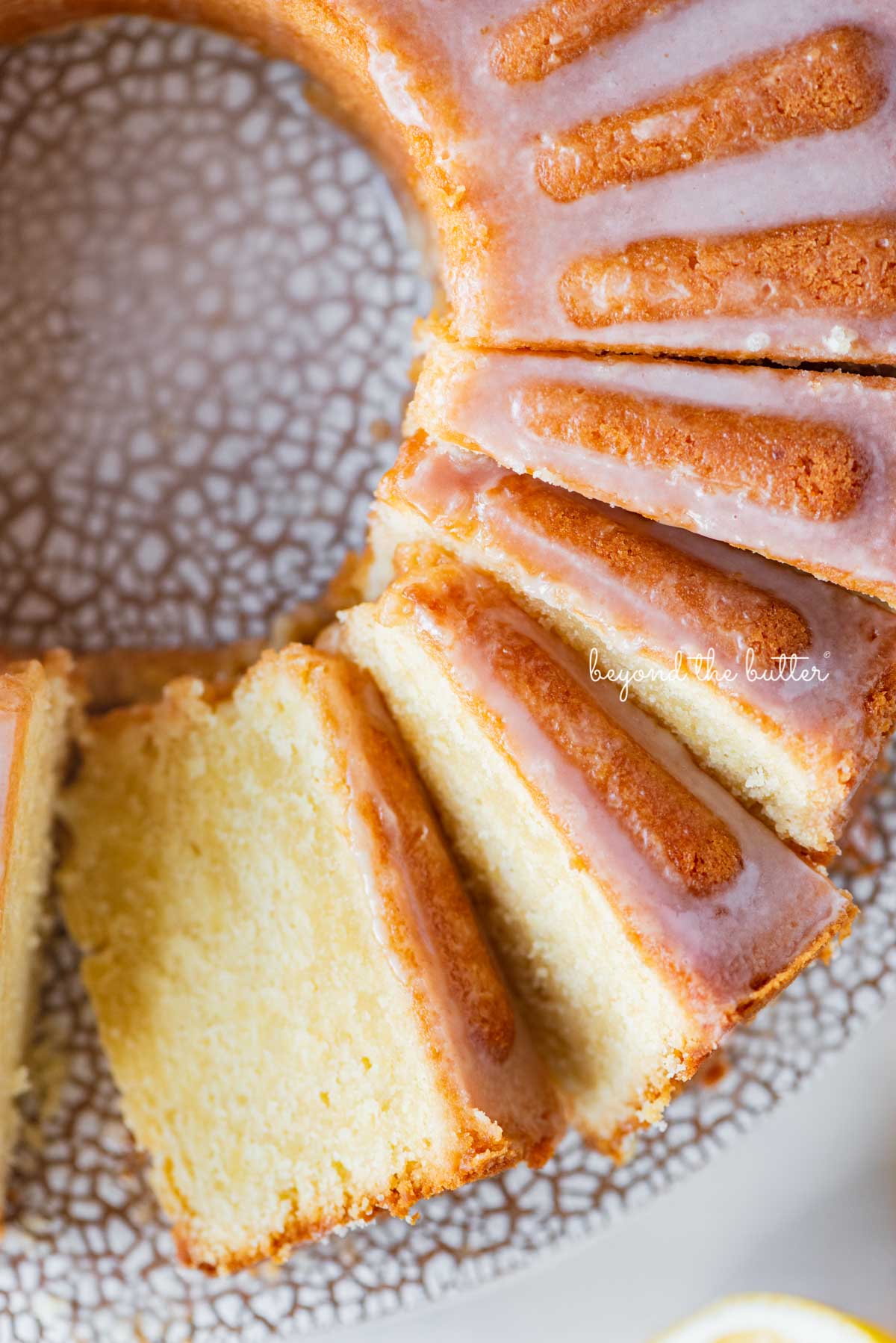 Soft and tender lemon cream cheese pound cake with a lemon glaze | © Beyond the Butter®