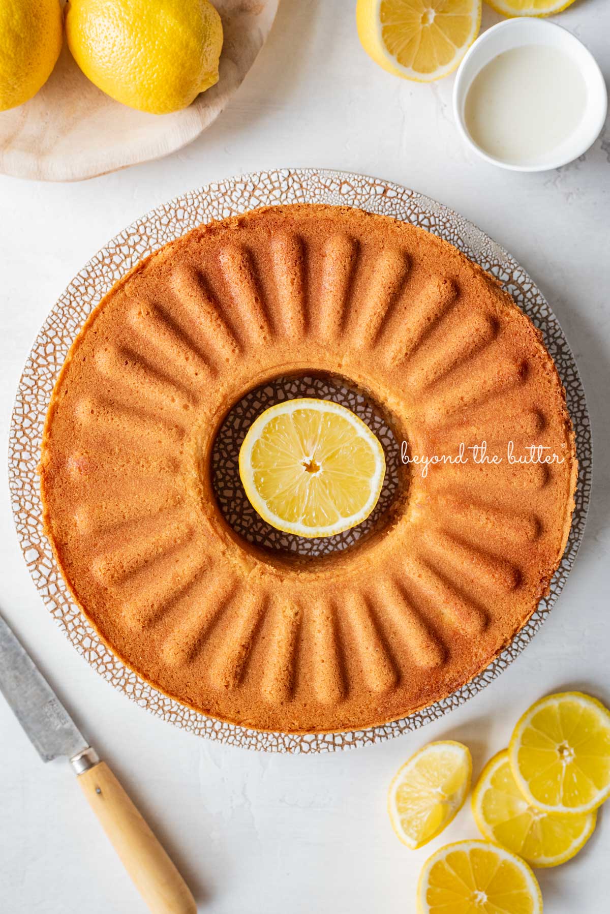 Pre-glazed lemon cream cheese pound cake baked in the IKEA Vadragen cake pan | © Beyond the Butter®