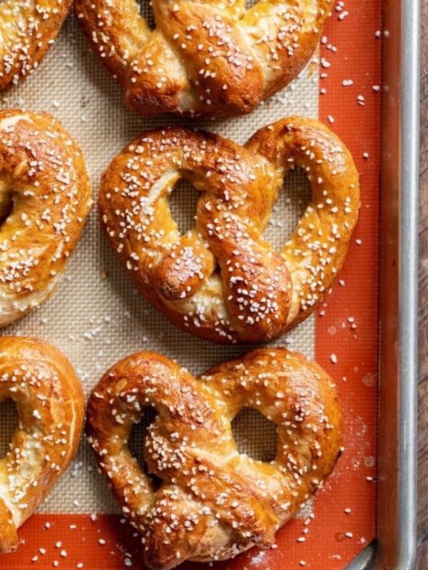Homemade soft pretzels with a golden brown crust and sprinkled with pretzel salt.