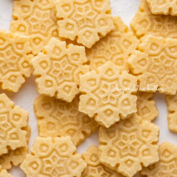 Randomly placed homemade butter cookies on a white background | © Beyond the Butter®