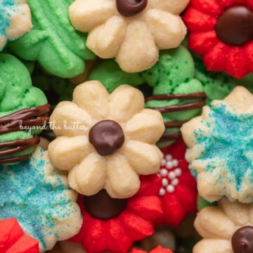 Pile of decorated buttery classic spritz cookies | © Beyond the Butter®