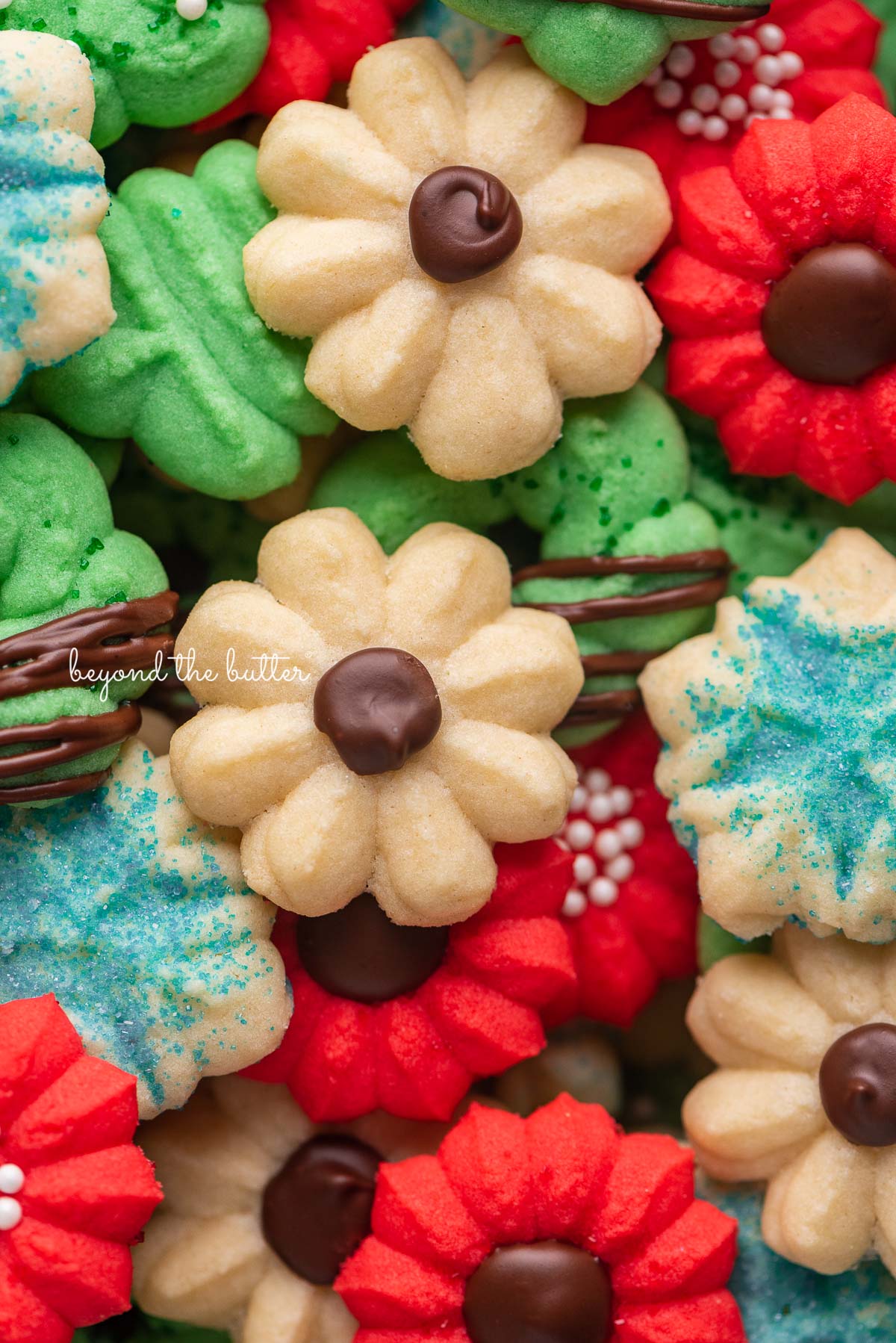 Pile of decorated buttery classic spritz cookies.