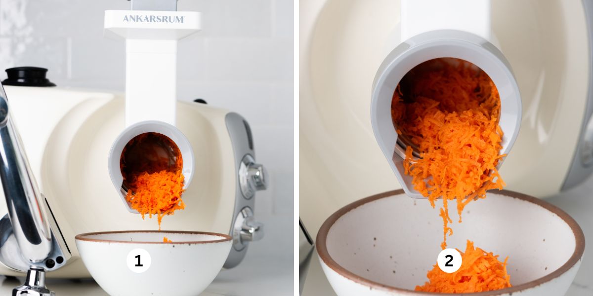 Using an Ankarsrum mixer and vegetable cutter attachment with medium grater drum to grate carrot into a white ceramic bowl on a white quartz and tiled background.