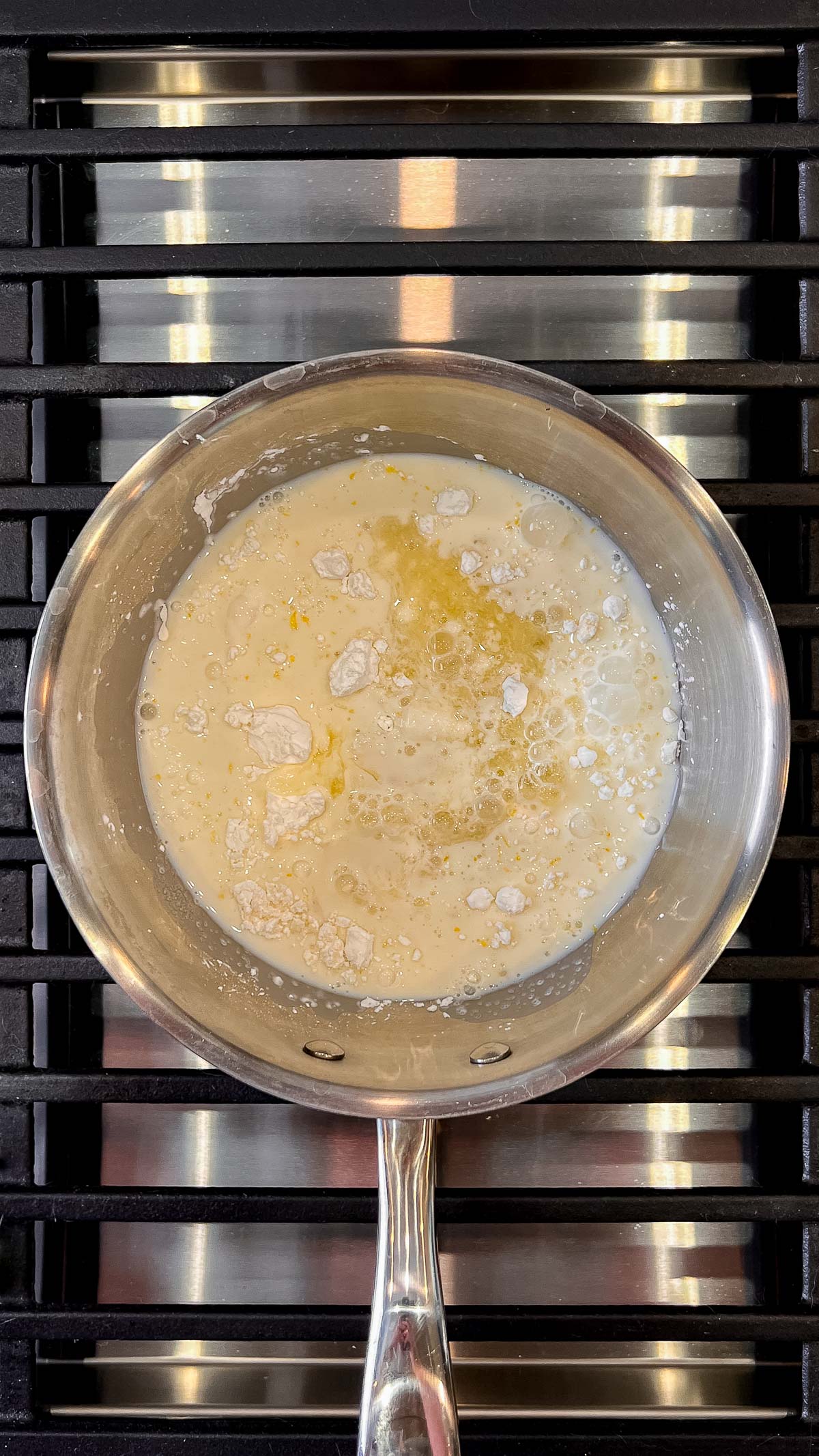 Milk, lemon juice, lemon zest, cornstarch, and granulated sugar in a saucepan over a medium high heat grill.